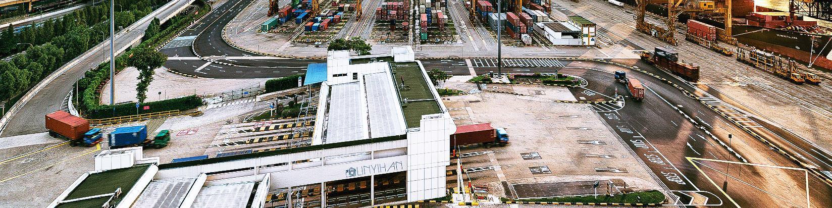 Aerial view of a container terminal gate with trucks